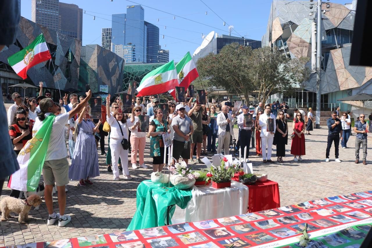 ALSA Nowruz 2585 gathering at Federation Square, 21 March 2026, with a Haft-Sin table and photographs of lives lost